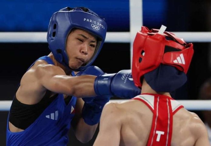 Filipina boxer Aira Villegas unloads a right straight to the face of Turkey’s Buse Naz Çakıroğlu. REUTERS