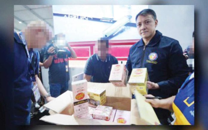 Bureau of Internal Revenue Commissioner Romeo Lumagui Jr. shows some of the confiscated illicit vape products during a raid at the Philippine Vape Festival 2024 on Sunday, August 18, in Las Piñas City. BIR PHOTO