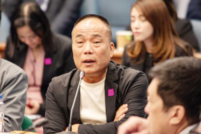 This undated photo shows former Philippine National Police chief Benjamin Acorda Jr. (third from left) and Chinese businessman Tony Yang (second from left), released by the office of Sen. Risa Hontiveros during a Senate inquiry on Sept. 24.