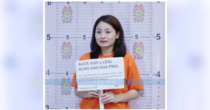 Department of Interior and Local Government secretary Benhur Abalos (left) and Philippine National Police chief Rommel Marbil (right) are pictured with a candid-looking arrested fugitive Alice Guo in Indonesia. NBI PHOTO