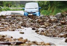 A road is covered with stones due to landslides caused by a torrential rain, in Wajima, Ishikawa Prefecture, Japan. REUTERS