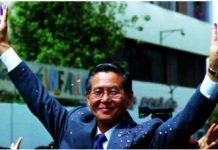 Peruvian President Alberto Fujimori gives the victory sign with ink-stained fingers after voting in the nation's first-ever constitutional referendum, October 31, 1993. Fujimori was in power from 1990 until 2000. REUTERS