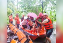 Personnel of the Bacolod City Disaster Risk Reduction and Management Office, Philippine Coast Guard and Philippine Army rescued residents from flood waters in Barangay Pahanocoy on Saturday, Sept. 14, 2024. BACOLOD CDRRMO PHOTO