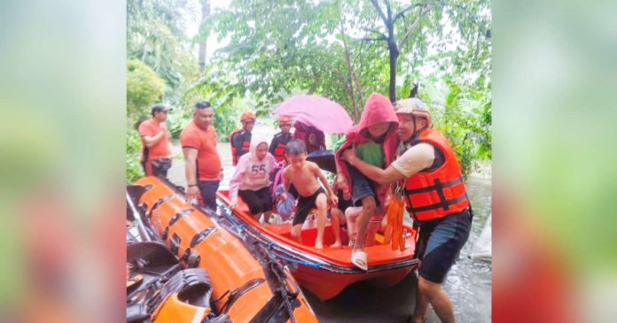 Personnel of the Bacolod City Disaster Risk Reduction and Management Office, Philippine Coast Guard and Philippine Army rescued residents from flood waters in Barangay Pahanocoy on Saturday, Sept. 14, 2024. BACOLOD CDRRMO PHOTO