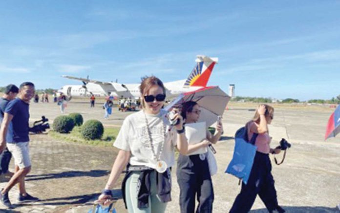 Tourists arrive at the Laoag International Airport in this undated photo. The Department of Tourism says providing incentives such as value-added tax refunds to foreign travelers would make the Philippines “competitive” as a destination among its peers in Southeast Asia. PNA FILE PHOTO BY LEILANIE ADRIANO