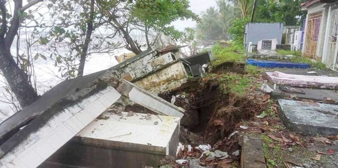 Tombs at Aguila Public Cemetery in Sebaste, Antique where visibly sinking due to the strong impact of waves on Saturday, Sept. 14, 2024. CHRISTINE MAE ANTONIO VIA DISCOVER ANTIQUE, PHILIPPINES PHOTO