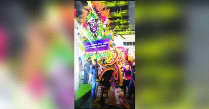 Five of the winning Ati-Atihan contingents in the Kalibo Sadsad Ati-Atihan contest highlighted their energetic street dancing, colorful costumes and the beating of drums during the 35th Philippine Travel Mart at SMX Convention Center. SCREENGRABBED FROM PHILIPPINE TRAVEL MART FACEBOOK VIDEO