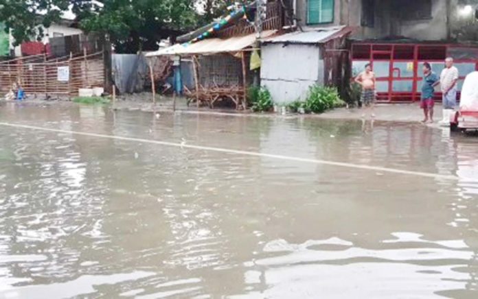 Flooding is experienced in Barangay East Timawa, Iloilo City. The City Risk Reduction Management Council advised residents in vulnerable areas to stay alert for potential flooding, especially with the expected heavy rainfall and strong winds associated with the storm. ILOILO CITY DISASTER RISK REDUCTION AND MANAGEMENT OFFICE PHOTO