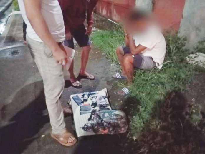 Truck driver Jarell Metcha, an alleged gunrunner, was apprehended in an entrapment operation in Barangay Mali-ao, Pavia, Iloilo on Monday night, Sept. 2. PN PHOTOS