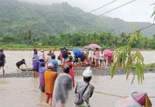 Due to heavy rains, rising waters in Ypayo River in Patnongon, Antique prompted authorities to prohibit students and local residents from crossing. Stranded individuals sought temporary refuge at Igburi National High School. PHOTO COURTESY OF THE MUNICIPALITY OF PATNONGON/FB