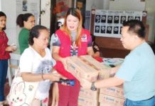 Monsoon-displaced individuals in Makato, Aklan queue to receive family food packs from the Department of Social Welfare and Development. During the habagat season, the predominant wind flow brings high levels of humidity and substantial rainfall. This often leads to intense and prolonged periods of rain, which often result in flooding, especially in low-lying and coastal areas. PHOTOS BY DSWD WESTERN VISAYAS