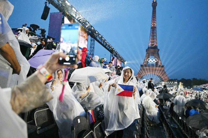 The mounting of direct Manila-Paris flights starting December 8, 2024 would enhance ease of travel and provide the much-needed connectivity to Europe. Photo shows attendees posing with a Philippine flag in the stands at the Trocadero during the opening ceremony of the Paris 2024 Olympic Games in Paris, France on July 26, 2024, with the Eiffel Tower in the background. OLI SCARFF, AFP