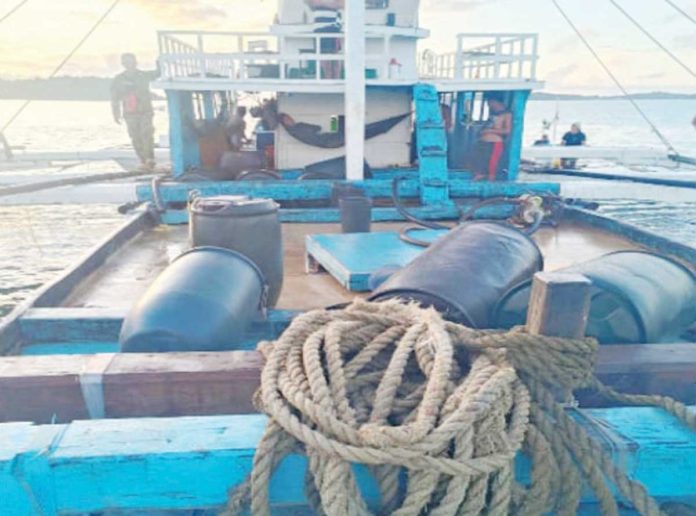 Western Visayas maritime police have taken custody of this fishing vessel that was allegedly involved in the illegal petroleum trade. The vessel and its eight crew members were intercepted in Carles, Iloilo on Sept. 26, 2024. REGIONAL MARITIME UNIT 6 PHOTO