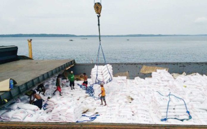 Sacks of rice from Thailand are loaded on a cargo ship docked at the Tabaco Port in Albay. NFA ALBAY FILE PHOTO