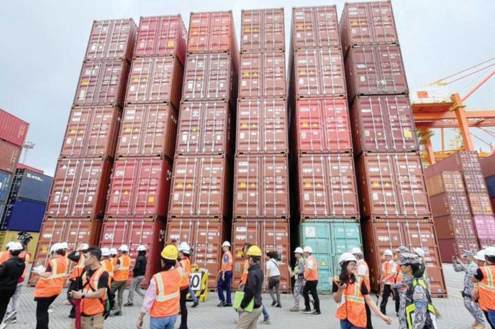 Almost half a million sacks of rice in more than 800 shipping containers remain uncollected at the Manila International Container port. JERVIS MANAHAN, ABS-CBN NEWS/PHOTO