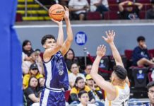 Adamson University Falcons’ Anthony Fransman shoots over the defense of University of Santo Tomas Growling Tigers’ Miguel Pangilinan. UAAP PHOTO