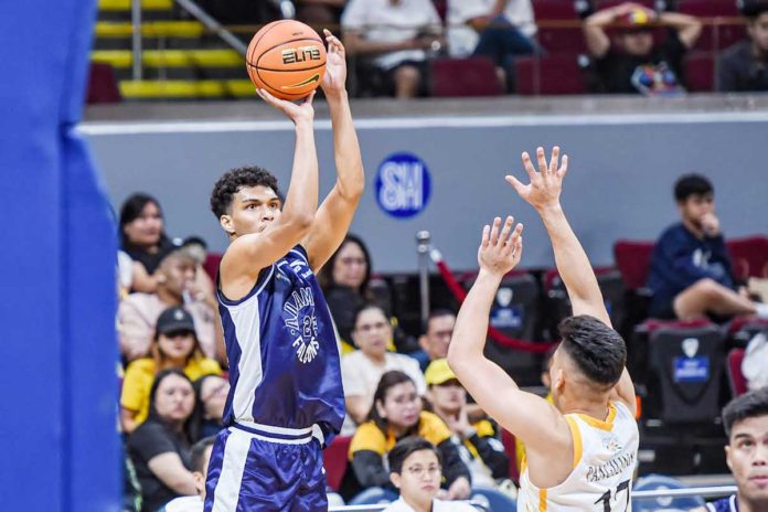 Adamson University Falcons’ Anthony Fransman shoots over the defense of University of Santo Tomas Growling Tigers’ Miguel Pangilinan. UAAP PHOTO