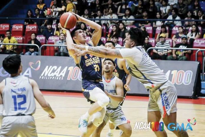 Negrense Lance Benitez of Jose Rizal University Heavy Bombers tries to score against an Arellano University Chiefs defender. PHOTO COURTESY OF NCAA/GMA SPORTS