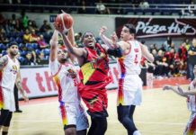 San Miguel Beermen’s Jordan Adams tries to score against the defense of Negrense Raul Soyud and Jason Perkins of Phoenix Fuel Masters. PBA PHOTO