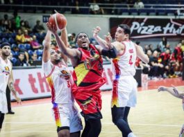 San Miguel Beermen’s Jordan Adams tries to score against the defense of Negrense Raul Soyud and Jason Perkins of Phoenix Fuel Masters. PBA PHOTO