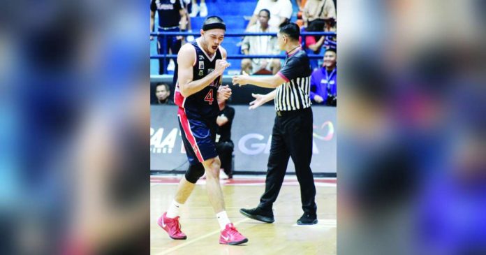 Colegio de San Juan de Letran Knights’ Kevin Santos reacts after knocking down the go-ahead basket against the College of St. Benilde Blazers. PHOTO COURTESY OF NCAA/GMA SPORTS