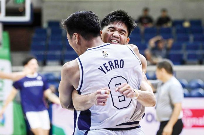 Adamson University Falcons’ Joshua Yerro hugs a teammate after his game-winning shot against National University Bulldogs. UAAP PHOTO