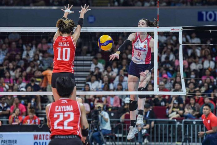 Creamline Cool Smashers’ Erica Staunton smashes the ball against the defense of Cignal HD Spikers’ Toni Rose Basas. PVL Photo. PVL PHOTO