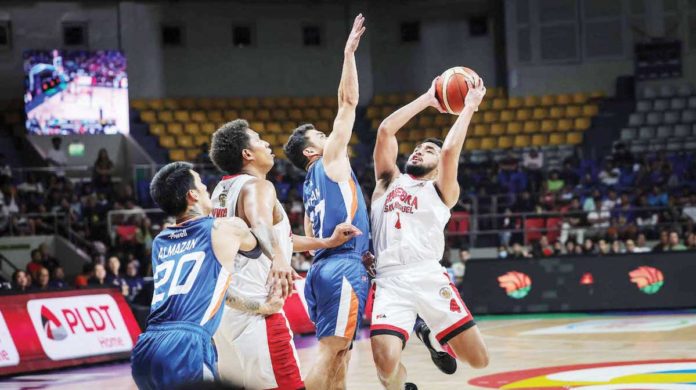 Barangay Ginebra San Miguel Kings’ Rhon Jhay Abarrientos attempts to score against the defense of Ilonggo Anjo Caram of Meralco Bolts. PBA PHOTO