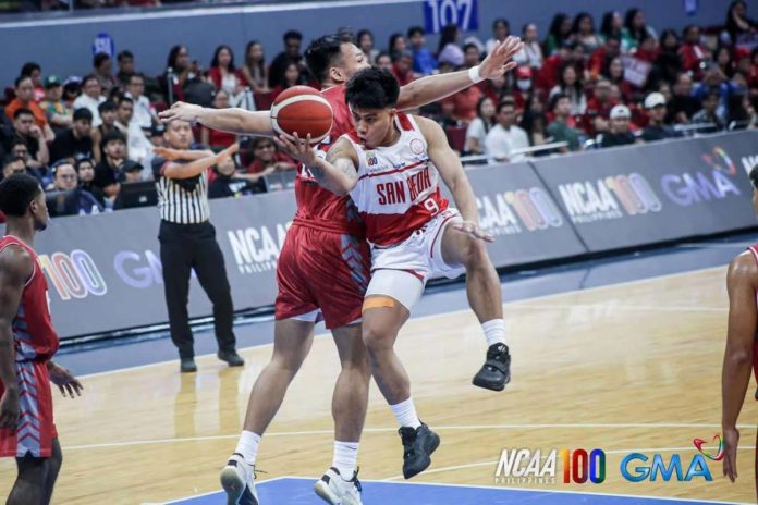 Ilonggo John Bryan Sajonia of San Beda University Red Lions goes for a tough basket against a Lyceum of the Philippines Pirates defender. PHOTO COURTESY OF NCAA/GMA SPORTS