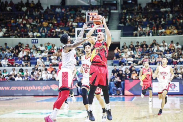 San Miguel Beermen’s Marcio Lassiter shoots over the defense of Barangay Ginebra San Miguel Kings’ Maverick Ahanmisi. PBA PHOTO