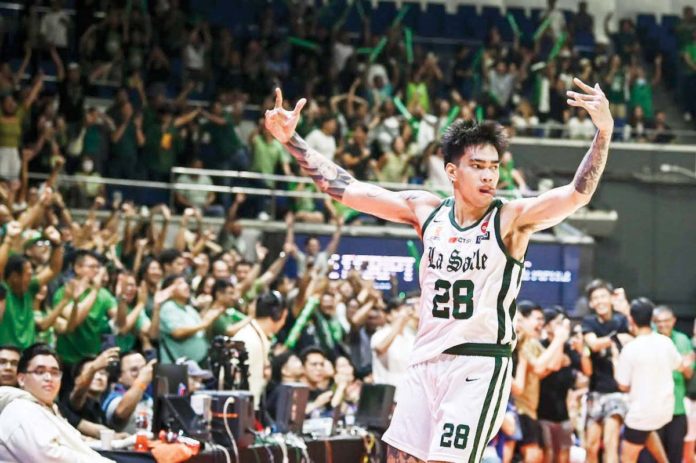 De La Salle University Green Archers’ Kevin Quiambao gestures to the crowd after converting a go-ahead three-pointer. UAAP PHOTO