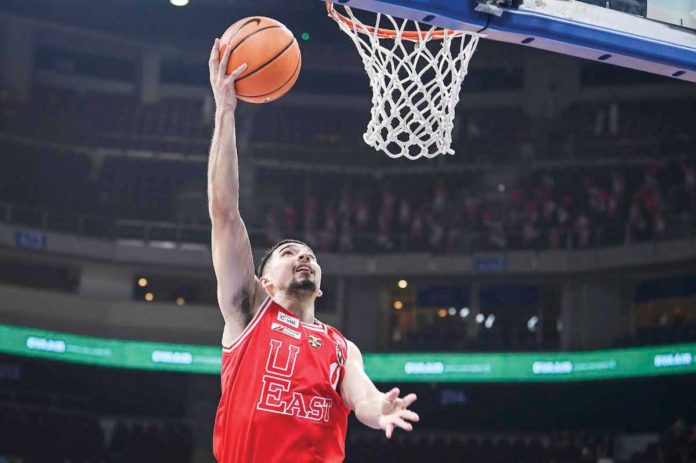 University of the East Red Warriors’ John Abate stretches for a layup. UAAP PHOTO