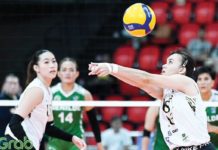 Negrense Cassie Carballo of University of Santo Tomas Golden Tigresses tosses the ball as her teammate Pia Abbu looks on. PHOTO COURTESY OF V-LEAGUE