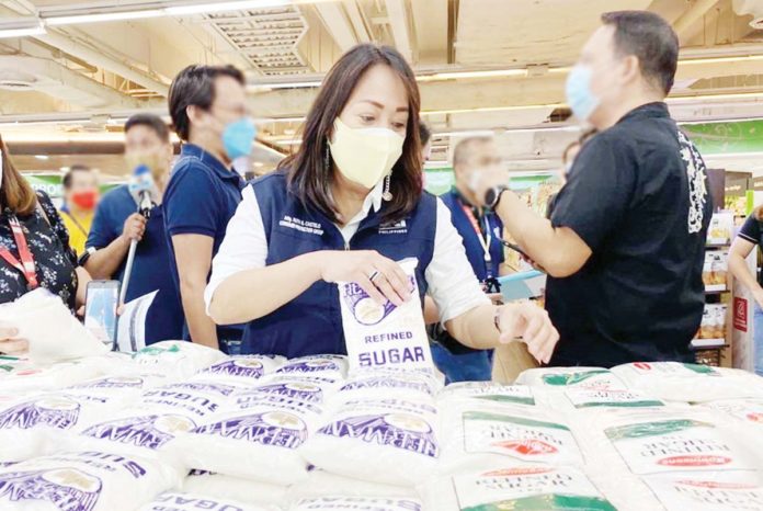 The Sugar Regulatory Administration assured the public of a stable supply of sugar until the end of the milling season around May or June 2025. File photo shows personnel of the Consumer Protection Group inspecting the sugar section of a supermarket in Manila. DTI PHOTO