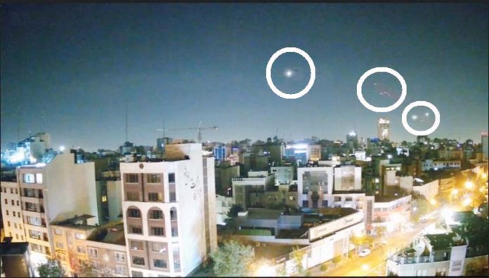 Projectiles are seen in the sky over Tehran as Israel hits Iranian targets.