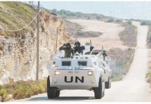 A United Nations peacekeeper vehicle drives along a road in Naqoura, near the Lebanese-Israeli border, southern Lebanon. REUTERS