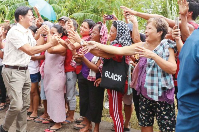 President Ferdinand R. Marcos Jr. on Saturday visited the victims of Severe Tropical Storm Kristine in Bula, Camarines Sur, to personally check on their condition and provide cash assistance to the needy.