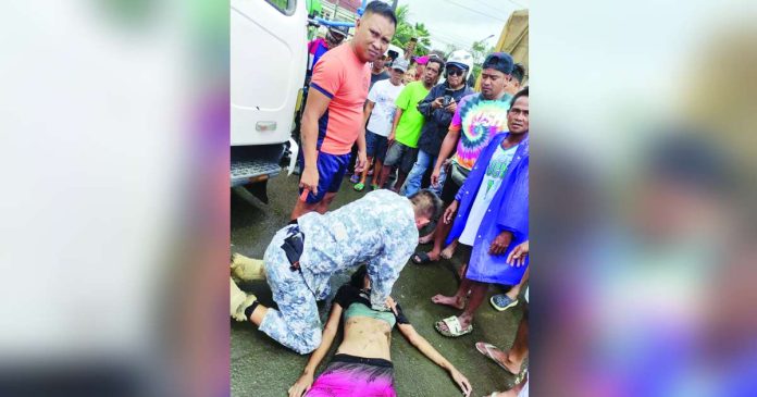 Philippine Coast Guard Iloilo City Station officer Christopher Palma administers cardiopulmonary resuscitation to revive the 16-year-old girl. PCG ILOILO STATION PHOTO