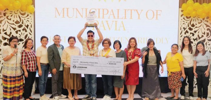 Mayor Laurence Anthony Gorriceta of Pavia, Iloilo, proudly accepts a plaque and a P50,000 cash prize as his town is honored as the “Most Senior Citizen-Friendly Municipality” in Iloilo Province. PHOTO FROM BALITA HALIN SA KAPITOLYO