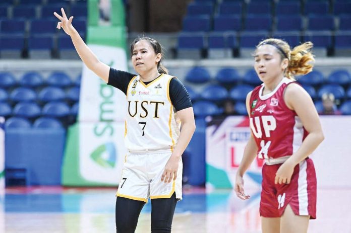 Ilongga Ana Tacatac of the University of Santo Tomas Growling Tigresses gestures after converting a three-pointer. UAAP PHOTO