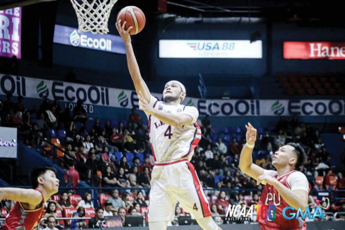 Colegio de San Juan de Letran Knights’ Bryan Santos scores on a layup. PHOTO COURTESY OF NCAA/GMA SPORTS