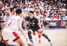 TNT Tropang Giga’s Rey Nambatac tries to score against the defense of Barangay Ginebra San Miguel Kings’ Japeth Aguilar. PBA PHOTO