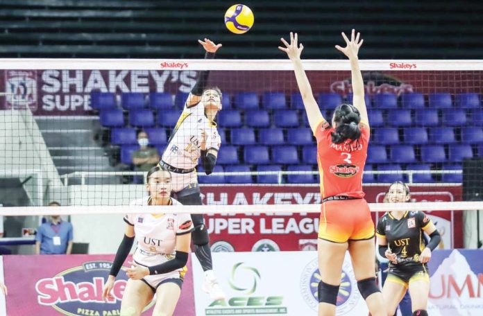 University of Santo Tomas Golden Tigresses’ Angeline Poyos goes for an attack. SSL PHOTO