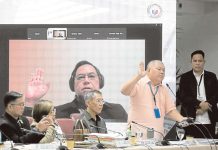 Former Police Colonel Eduardo Acierto (in dark shirt) takes his oath via recorded Zoom during the 10th Quad Comm hearing held at the House of Representatives. He claimed that a P50-million bounty on his head was placed after implicating two Chinese friends of then president Rodrigo Duterte in the narcotics trade.