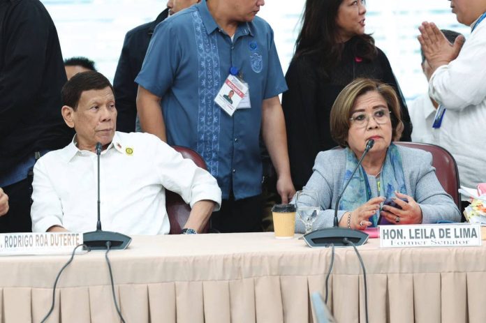 Former President Rodrigo Duterte was seated beside former senator Leila De Lima during the House of Representatives’ probe on drug war killings during his administration. PHOTO COURTESY OF THE HOUSE OF REPRESENTATIVES