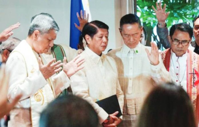 Various religious leaders pray with President Ferdinand “Bongbong” Marcos Jr. during the 49th Philippine National Prayer Breakfast on Monday. “Our collective faith and prayer to the Almighty is the most powerful tool that we have to weather these storms and the destruction that they bring,” says the President. PCO