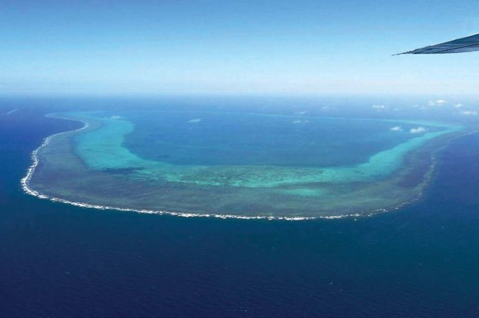 This photo taken on February 15, 2024, shows an aerial view of the Scarborough Shoal in the West Philippine Sea. Photo by JAM STA ROSA / AFP