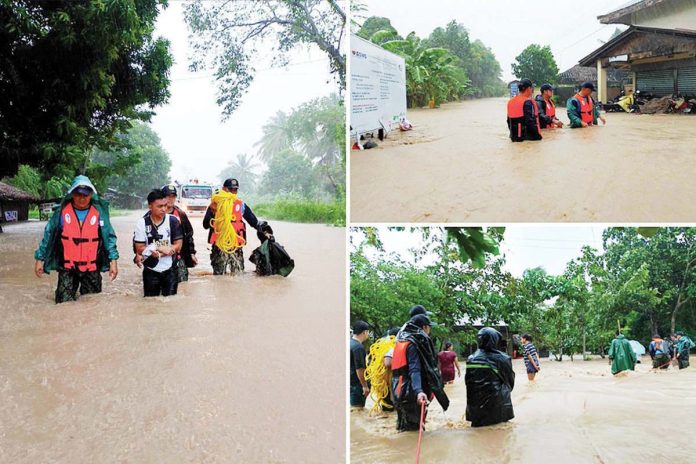 Local government personnel rescue residents in various barangays in Libon town, Albay province who were severely affected by massive flooding brought about by Tropical Storm Kristine on Oct. 22, 2024. PNA