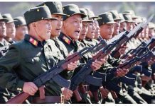 North Korean soldiers march during a mass rally. GETTY IMAGES