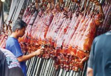 Rows of “lechon” for pre-paid and last-minute customers are on display in Barangay La Loma in Quezon City on Christmas Eve in this file photo. MARK DEMAYO/ABS-CBN NEWS PHOTO